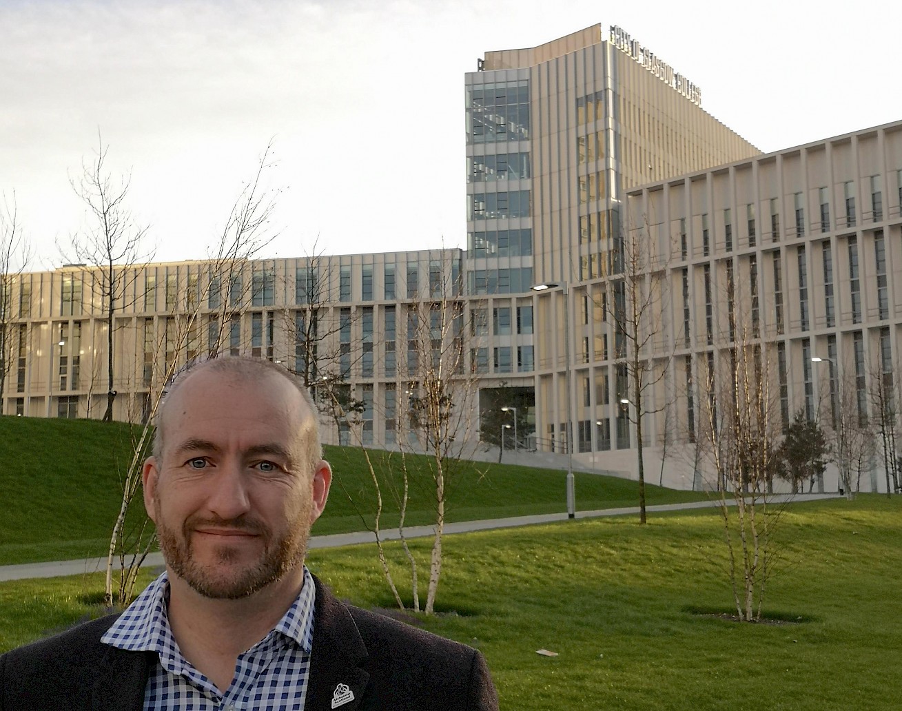 Image of John outside the City of Glasgow College.